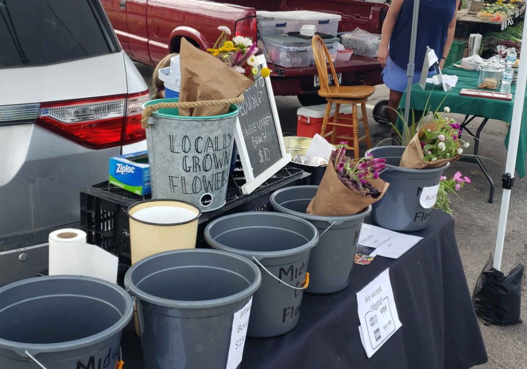 selling flowers at the farmers market