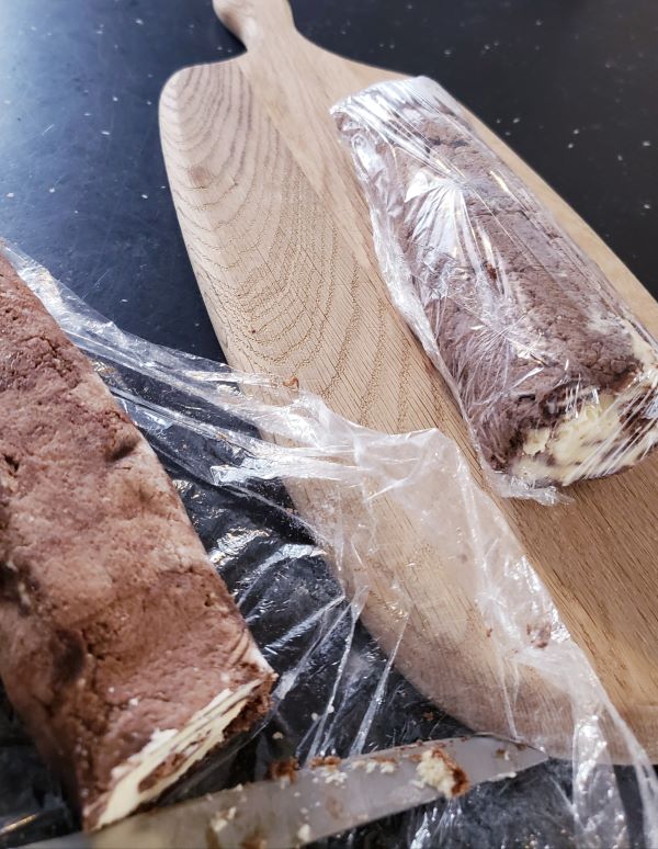 Chocolate dream roll in plastic wrap.