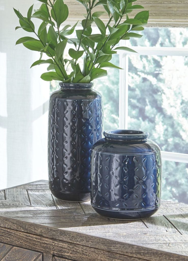 Navy blue accent vase with texture.