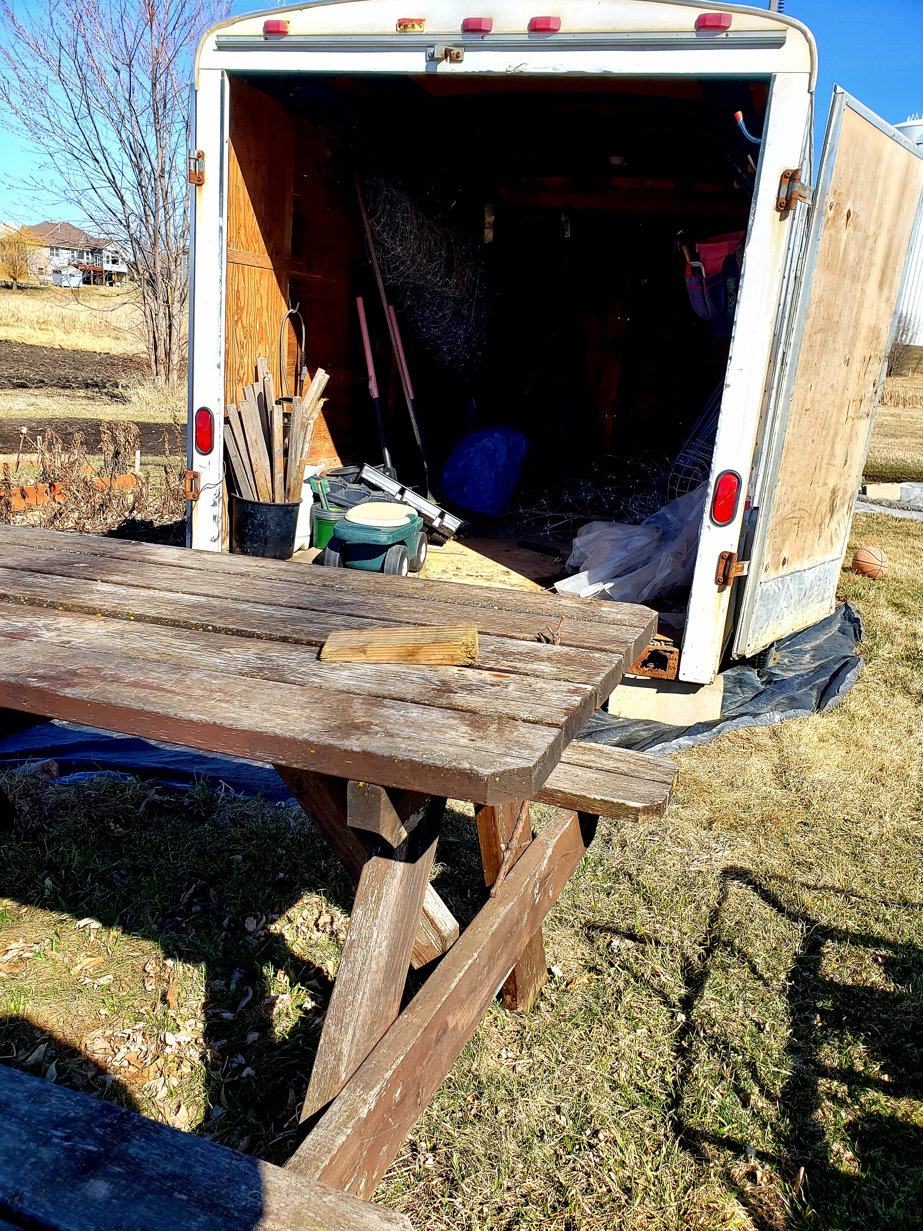 covered trailer and picnic table