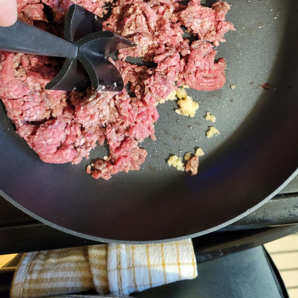 raw ground beef in pan