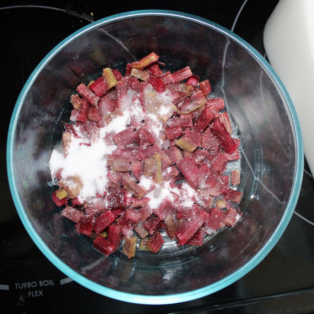 rhubarb and sugar in a glass bowl