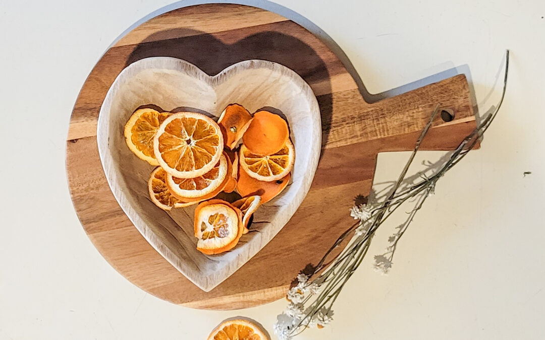 Dried oranges in a heart shape bowl